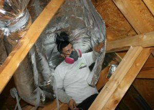 Radiant barrier being installed in an attic