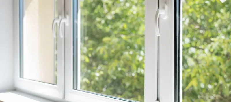new pvc window with white metal frame installed at modern house