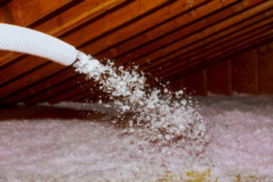 Blown-in insulation being installed in an attic